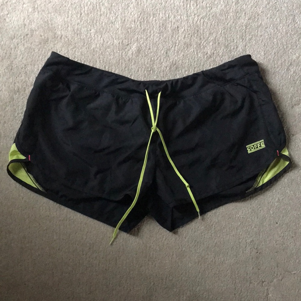 Black and green athletic shorts with built in breathable under where